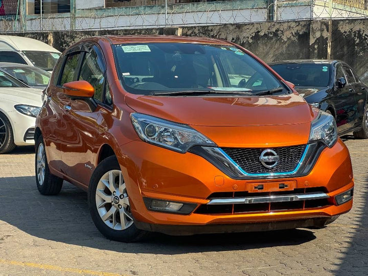 2019 Nissan Note in orange, photo 1 of 13, for sale in Kenya (Ref N19-04734)